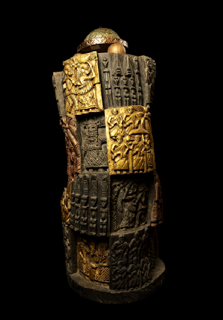 Carved wooden totem with gold panels